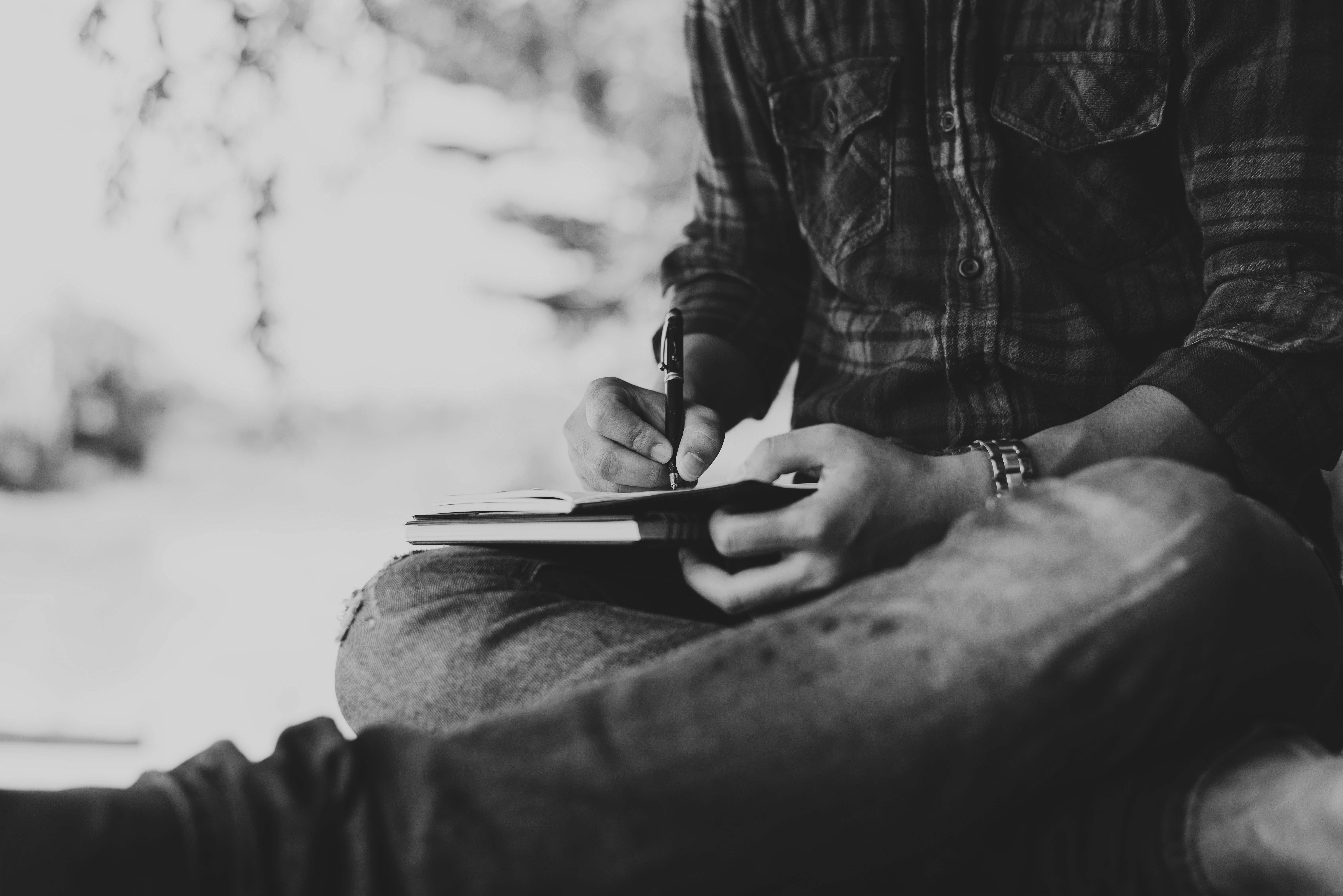 hands-writing-legs-crossed-black-and-white.jpg