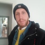 a picture of a man in a beard wearing a beanie hat
