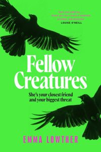 images Two black crows on a bright green background frame the title "Fellow Creatures" in white. Text below reads "She's your closest friend and your biggest threat." Author's name, Emma Lowther, is in pink. Tone is ominous and mysterious.